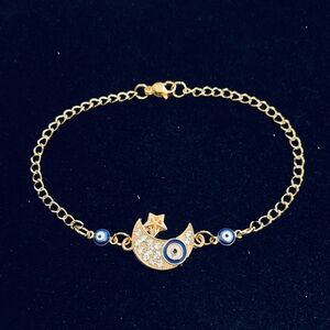 Rhinestone Crescent Moon with Evil Eye bracelet gold
